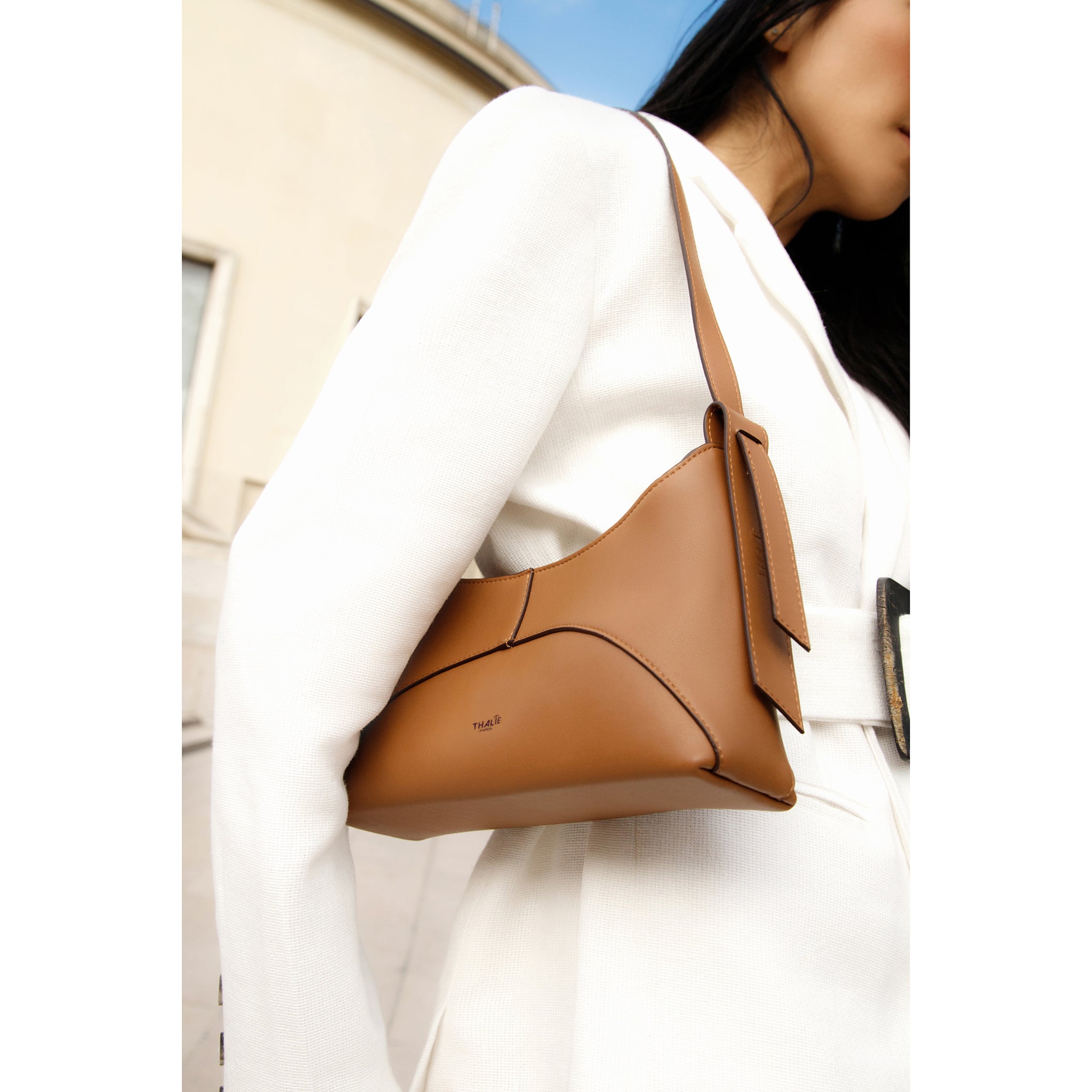Ambre Tan sustainable handbag styled with an elegant outfit for a versatile look
