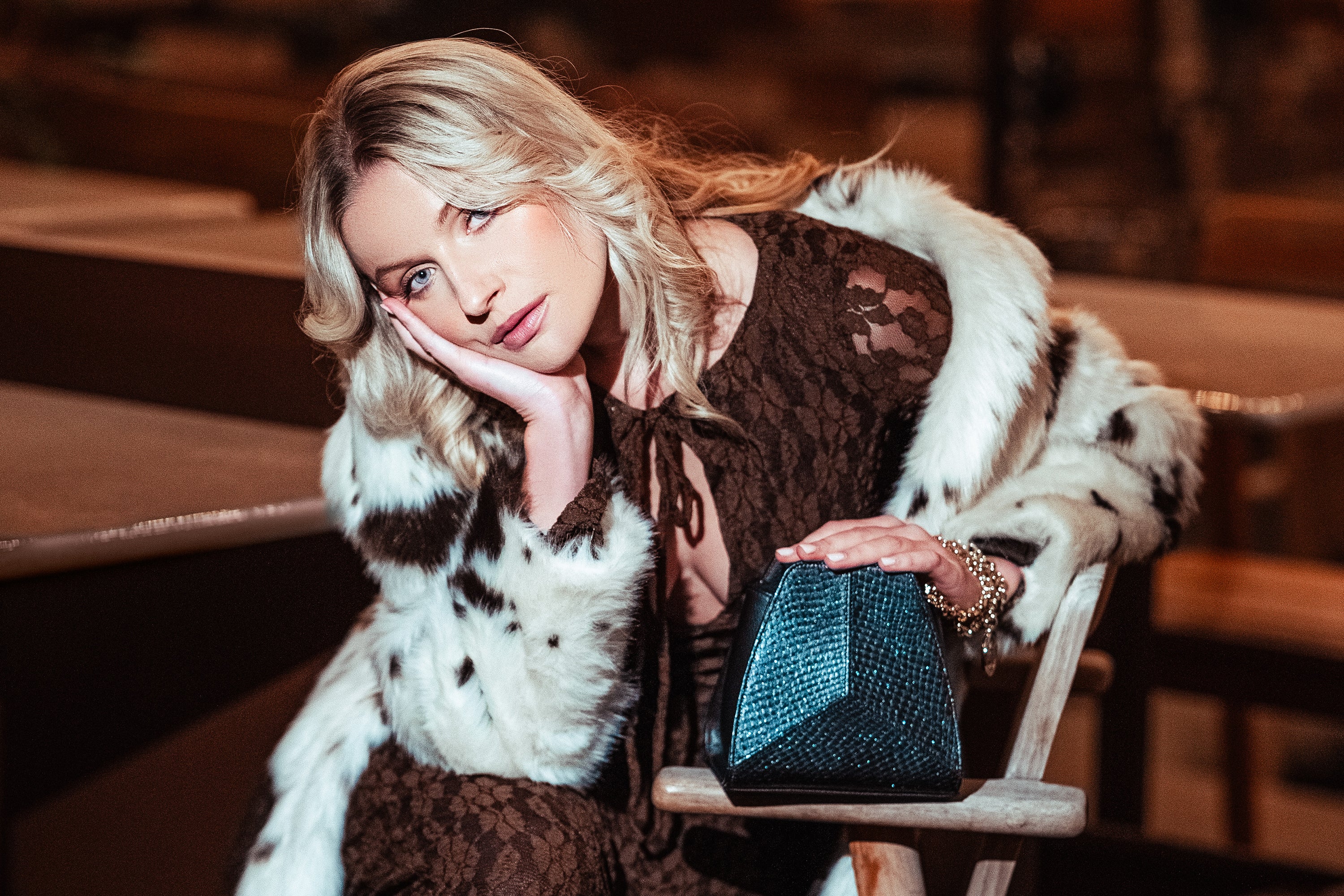 Thalie Paris Marine Leather Collection. Model with handcrafted geometric handbag in marine leather, made in France from upcycled salmon skin, blending Parisian elegance with sustainable luxury.