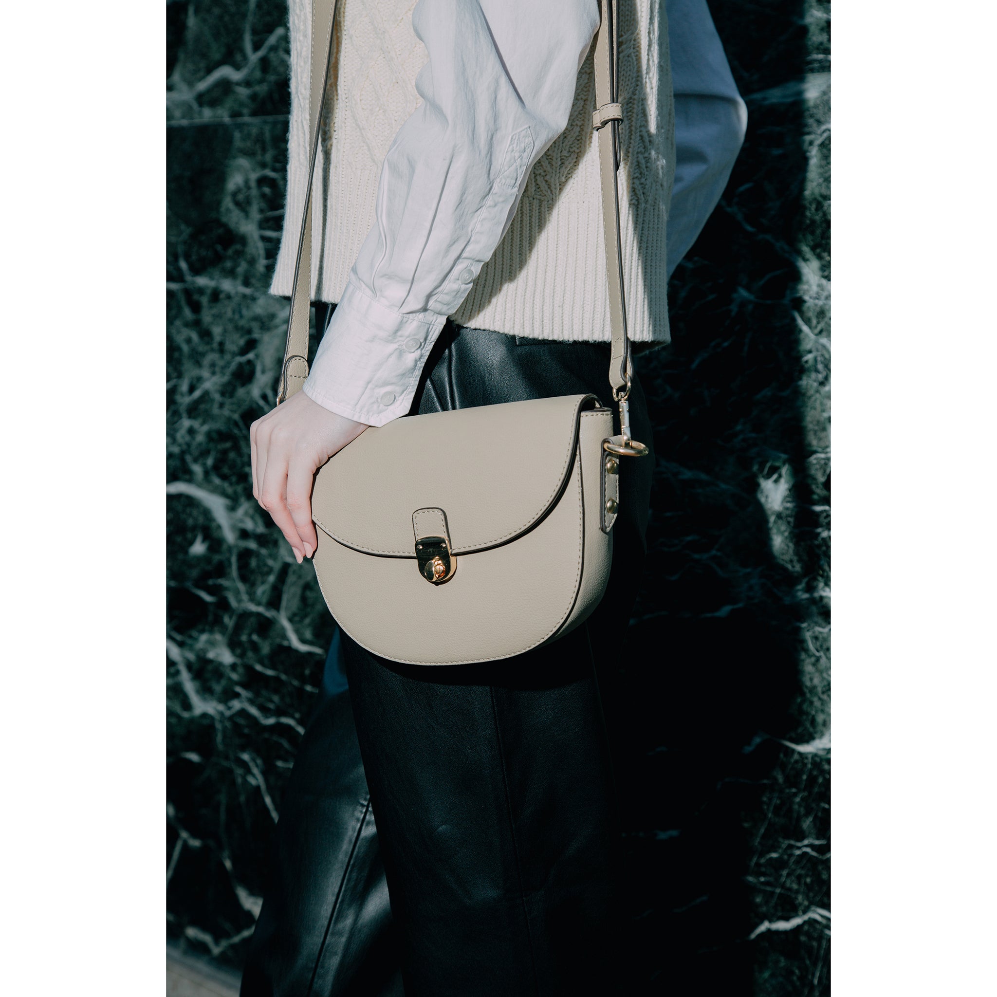 Close-up of Florine crossbody bag's intricate detailing and soft geometrical shape, crafted from sustainable cactus material by Thalie Paris.