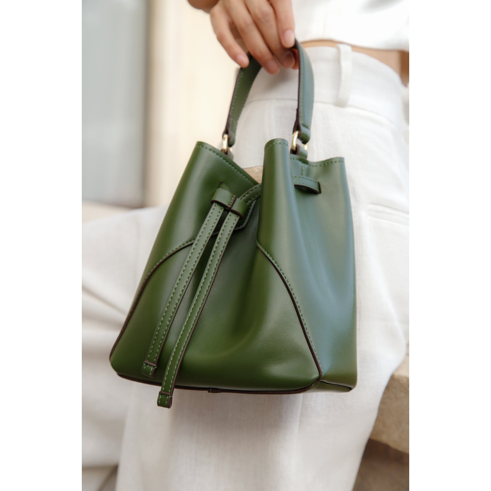 Mia Green Bucket Bag paired with a chic outfit for everyday wear. Thalie Paris