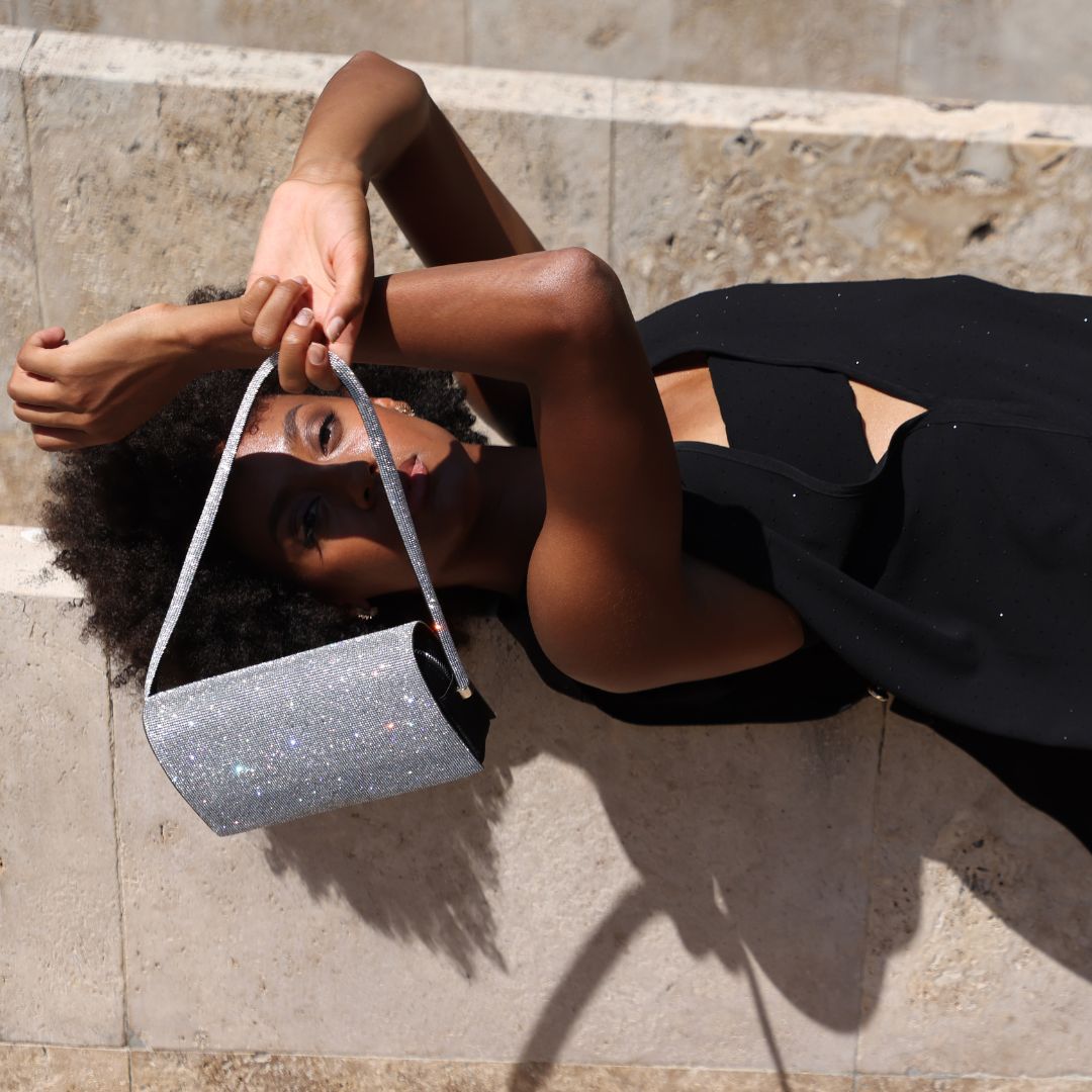 Luxury Italian evening bags by Thalie Paris, handcrafted in satin and embellished with sparkling strass crystals. Eco-luxury handbags made in Italy.